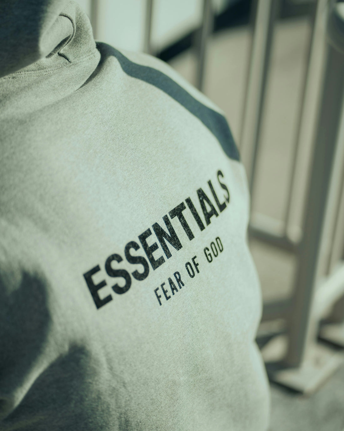 An essentials sweatshirt with fear of god printed.