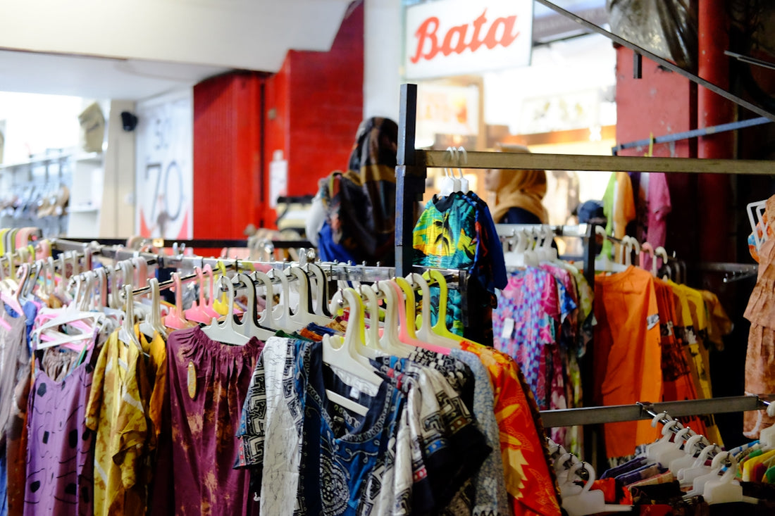 a rack of clothes in a clothing store