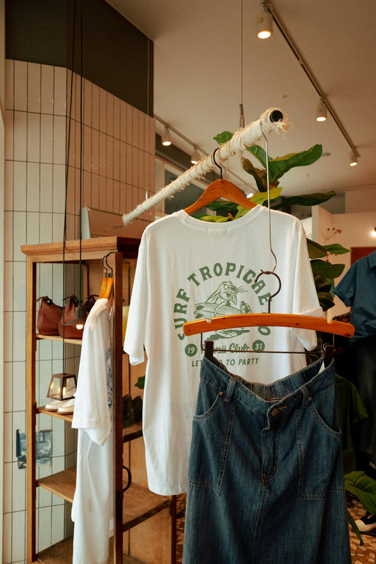 a pair of jeans hanging on a rack in a store
