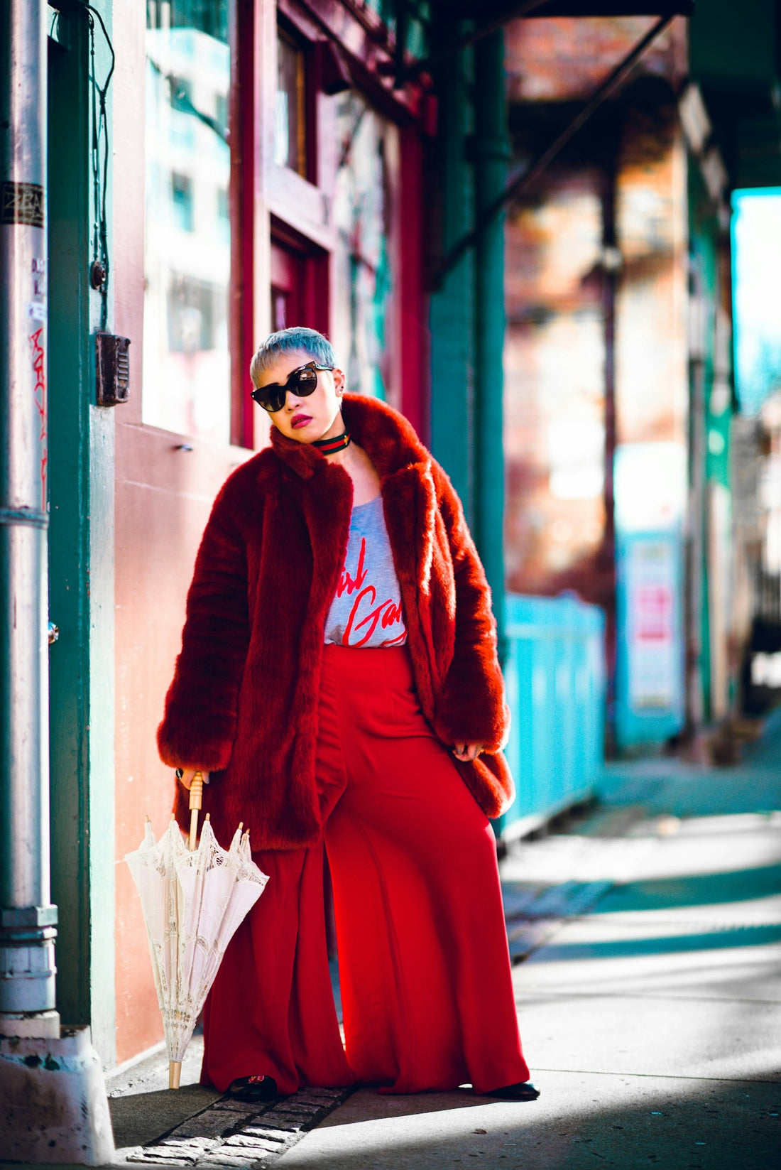 a woman in a long red skirt and fur coat