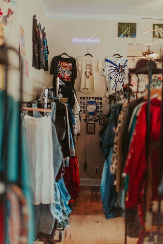 A clothing store with clothes hanging on the wall