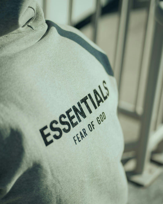 An essentials sweatshirt with fear of god printed.